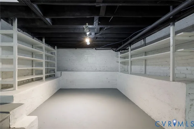 a view of a garage with wooden table and chairs