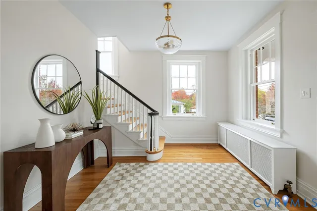 a view of entryway with wooden floor and a window