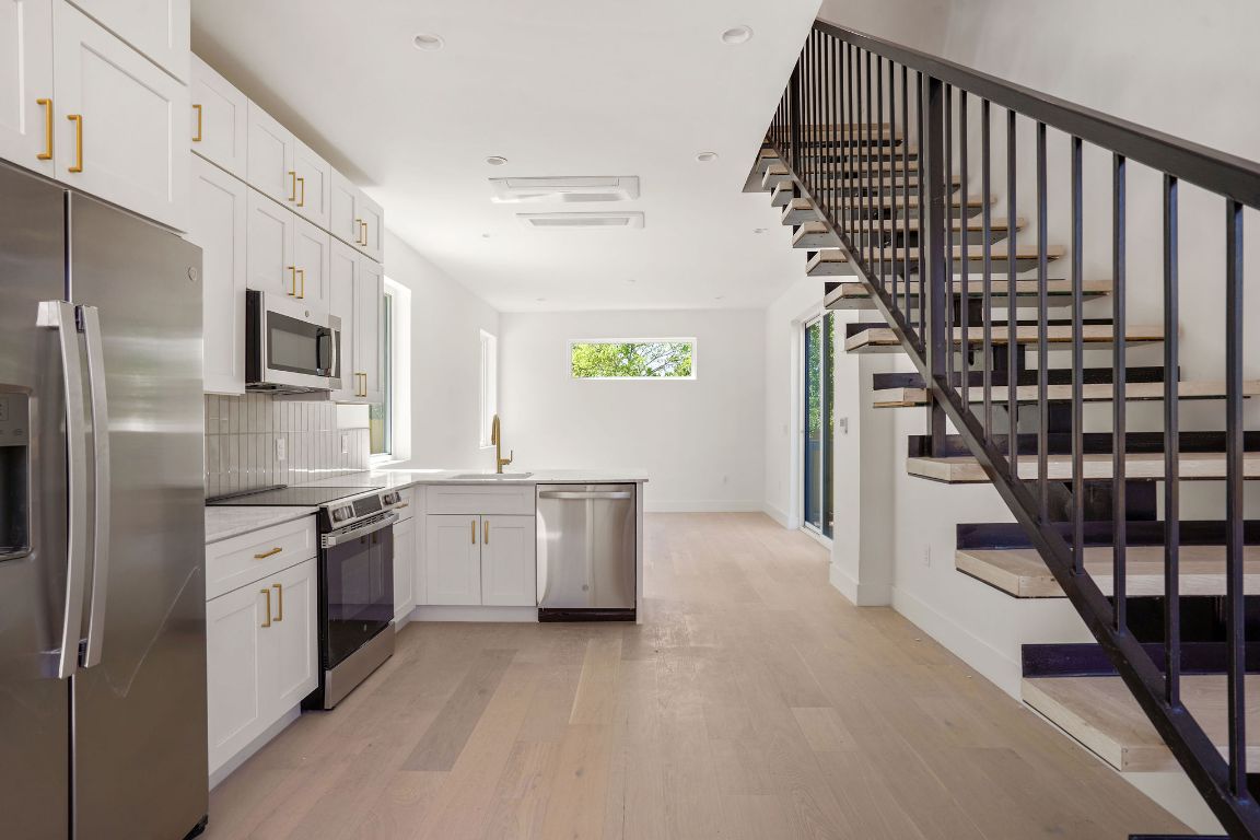 2609 Davis Lane, Unit 2 Austin, TX 78748 - Photo 5 of 23 a kitchen with cabinets and stainless steel appliances
