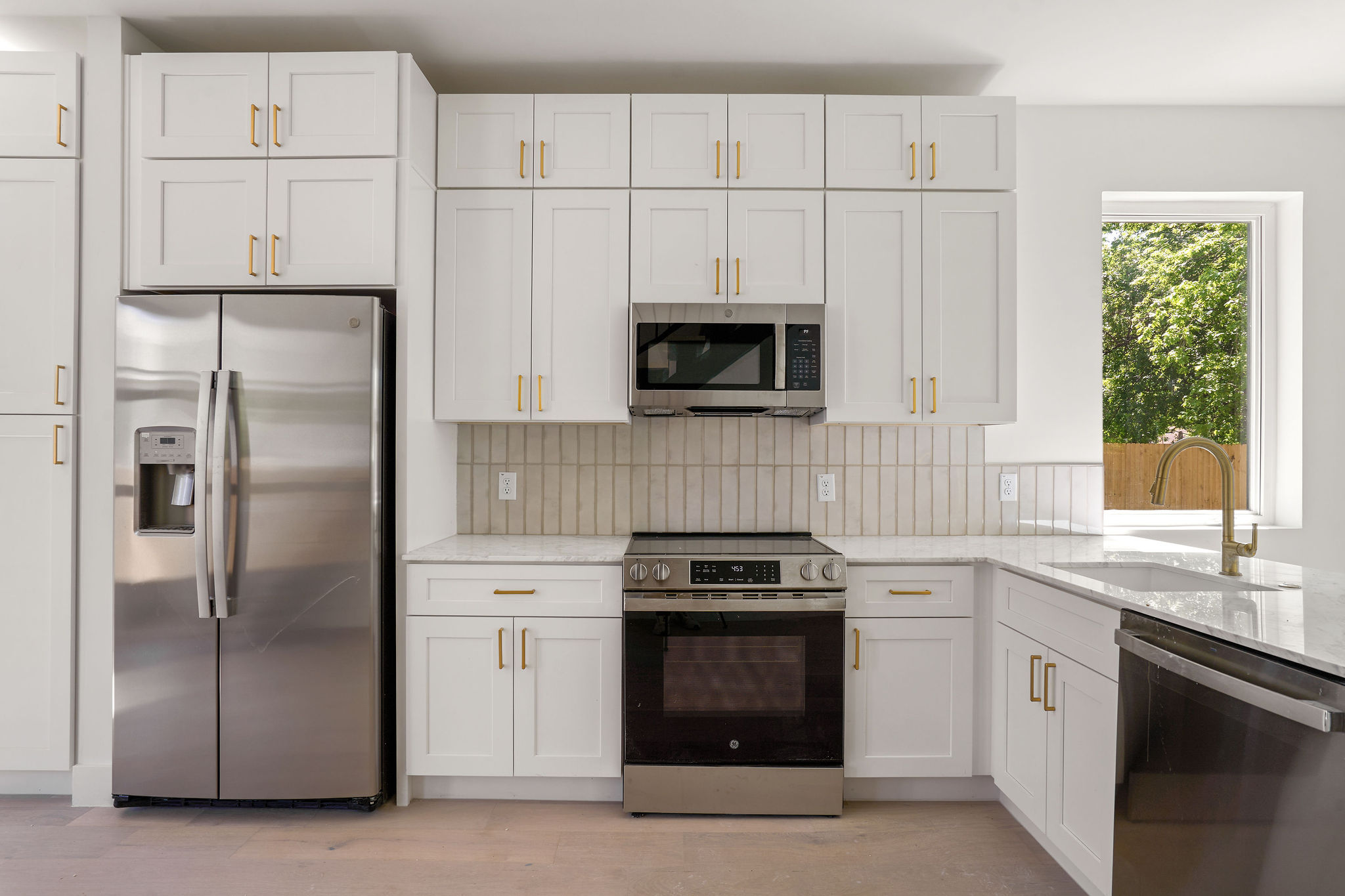 2609 Davis Lane, Unit 2 Austin, TX 78748 - Photo 8 of 23 a kitchen with a refrigerator stove and microwave