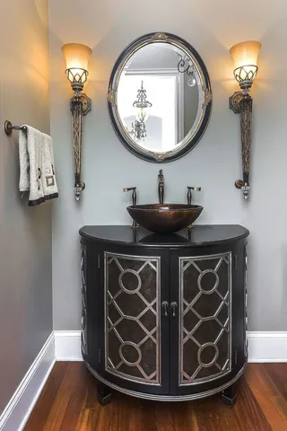 a bathroom with a mirror and a sink
