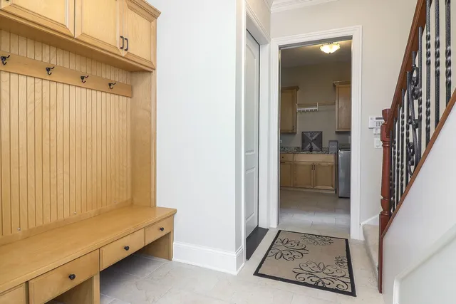 a kitchen with granite countertop white cabinets sink and stainless steel appliances