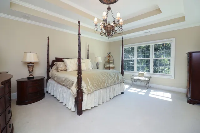 a bedroom with a bed and a television in it