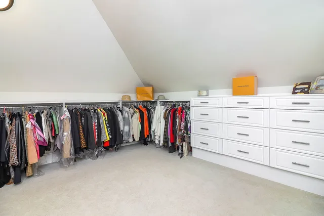 a bedroom with a bed couch and window