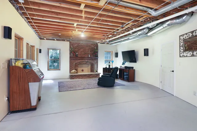 a view of a chairs and table in the balcony