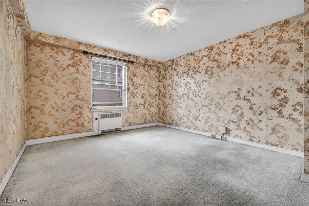 13800 Fairhill Road Cleveland, OH 44120 - Photo 22 of 23 Carpeted empty room with radiator