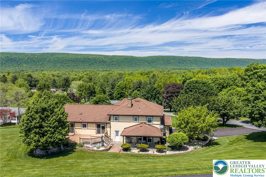 947 Tamenend Road Bath, PA 18014 - Photo 51 of 61 A private hilltop residence offers verdant views and abundant outdoor leisure space.