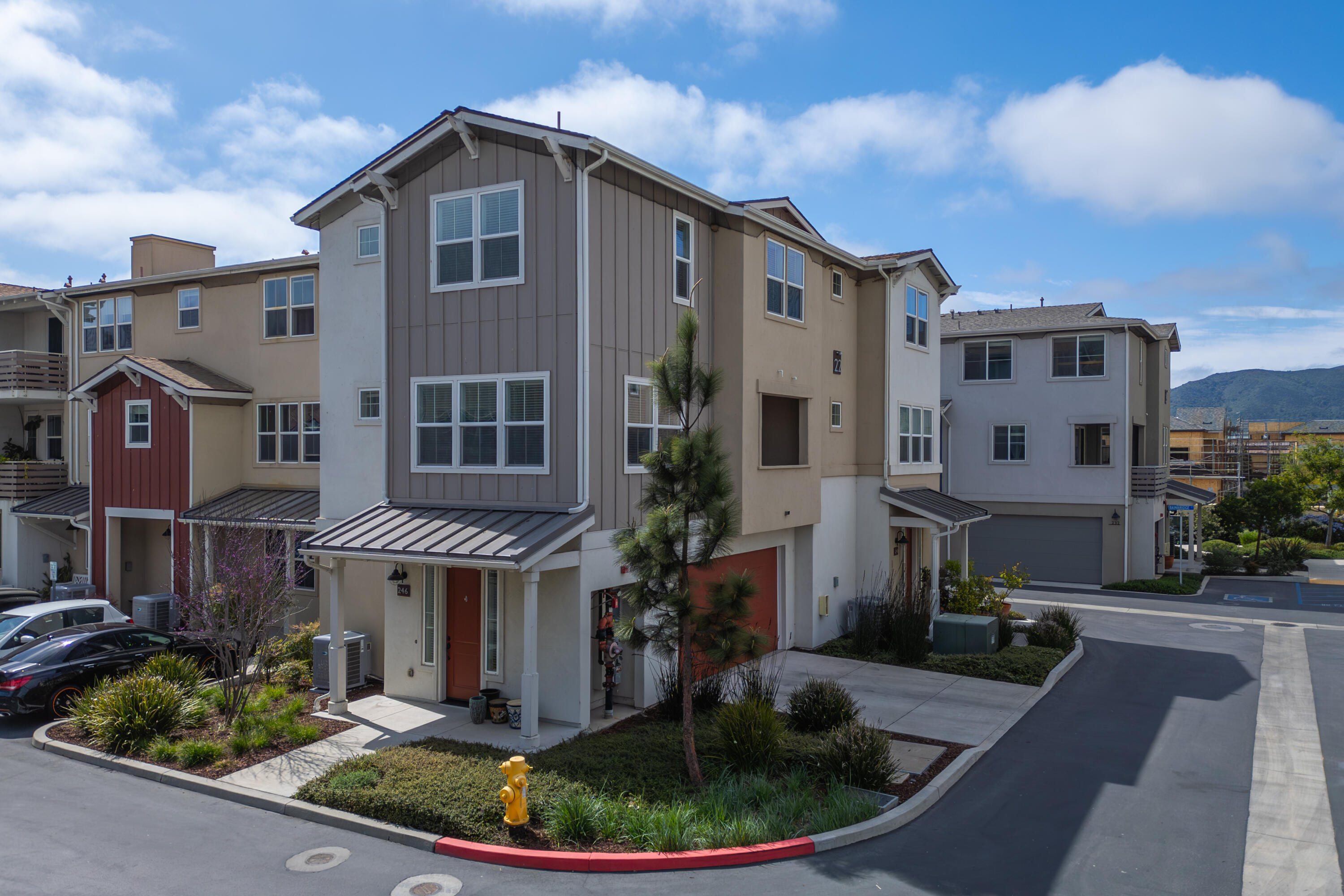a front view of a house with a yard glass top table and chairs