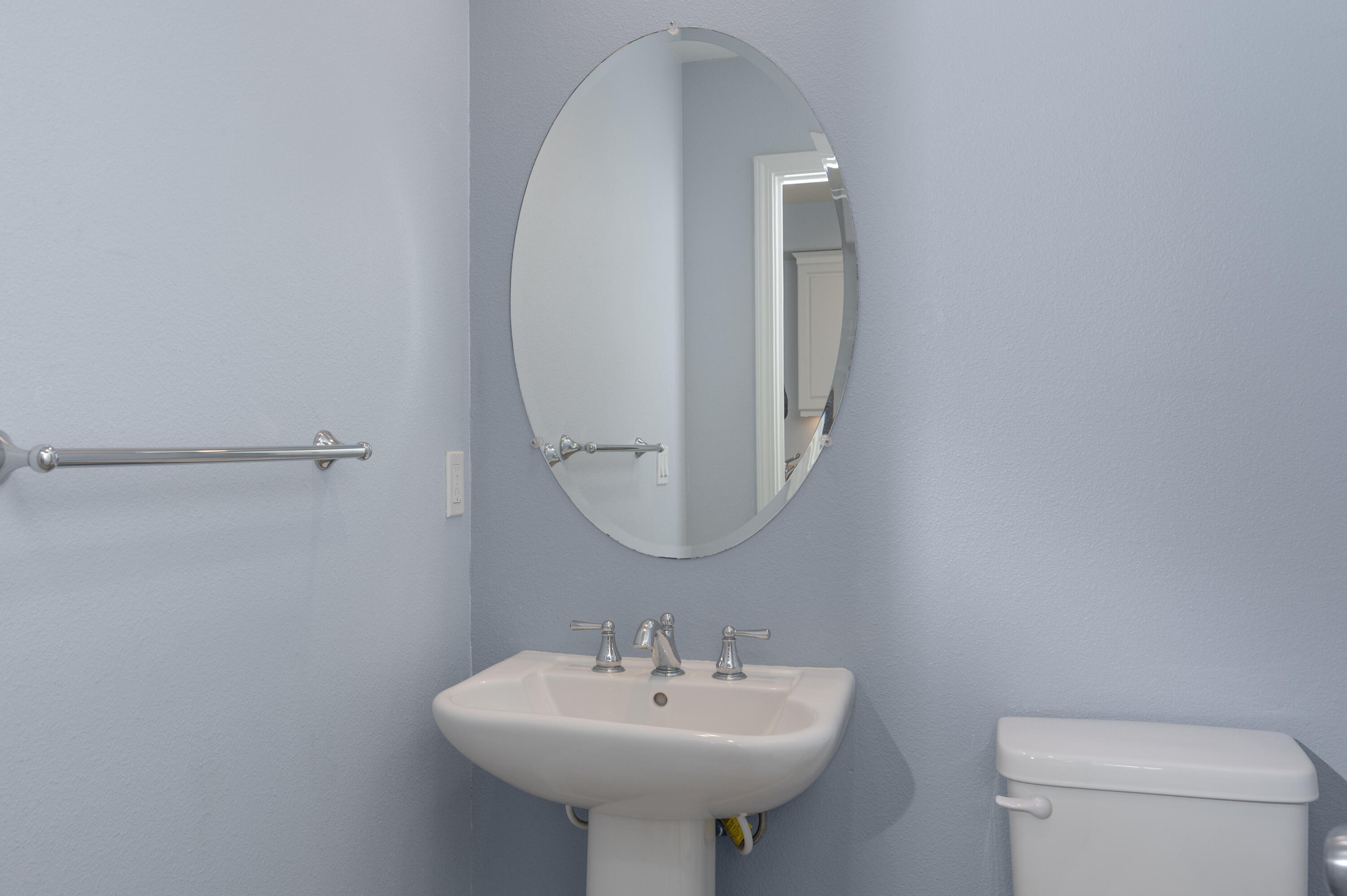 246 Robles Way Buellton, CA 93427 - Photo 12 of 26 a bathroom with a sink a mirror and a toilet