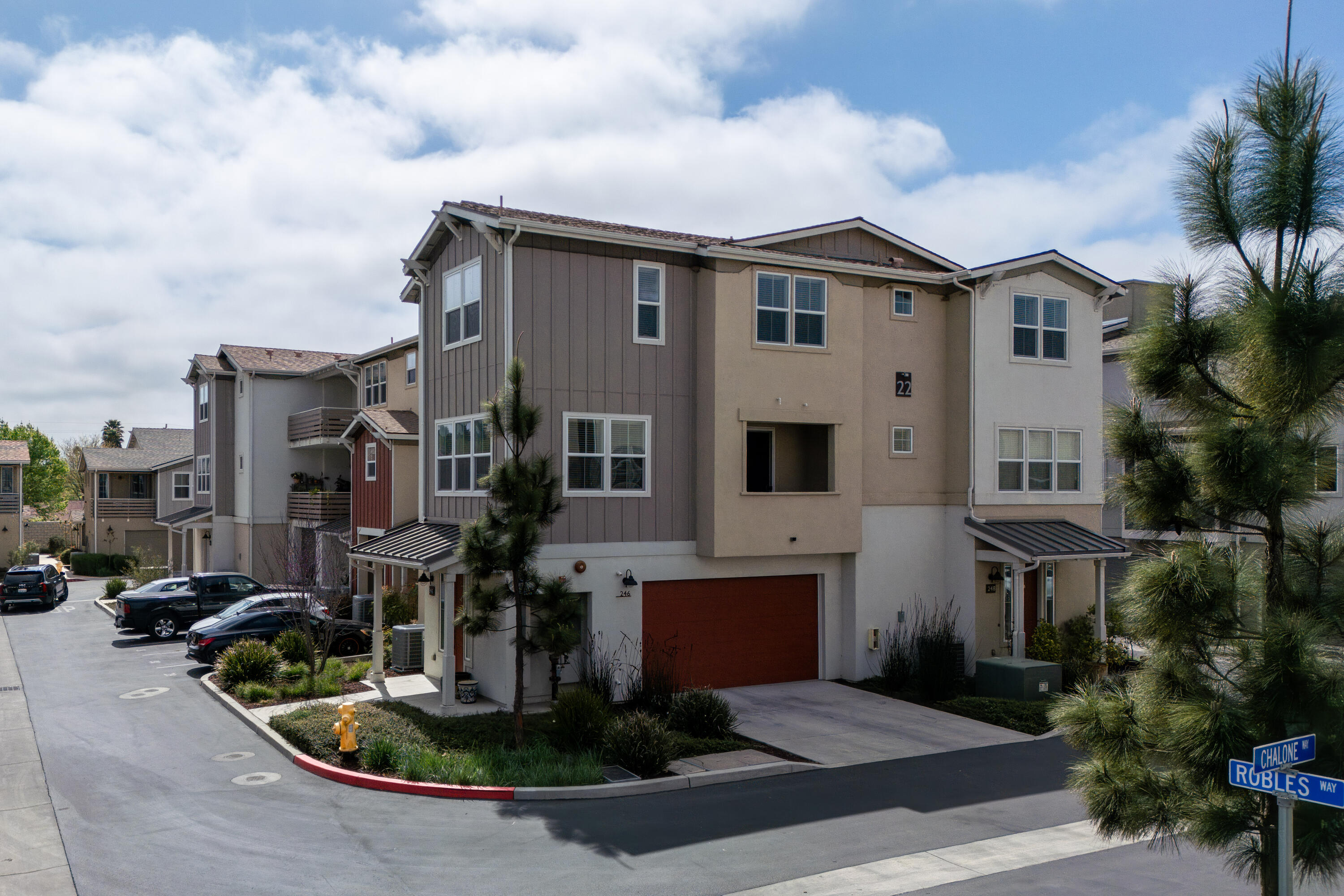 246 Robles Way Buellton, CA 93427 - Photo 3 of 26 a view of a white house with a sink and a yard