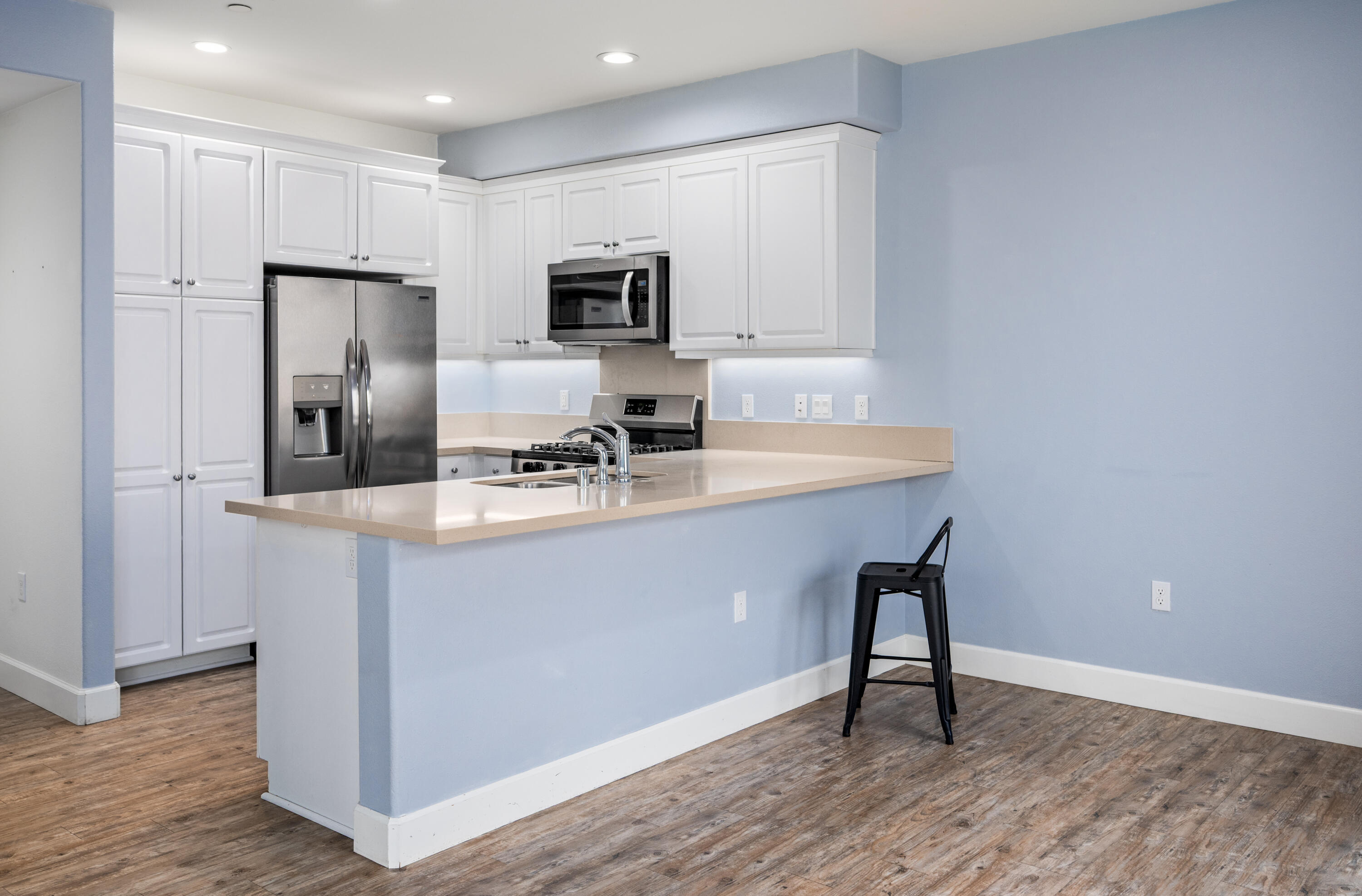 246 Robles Way Buellton, CA 93427 - Photo 8 of 26 a kitchen with a sink cabinets and wooden floor