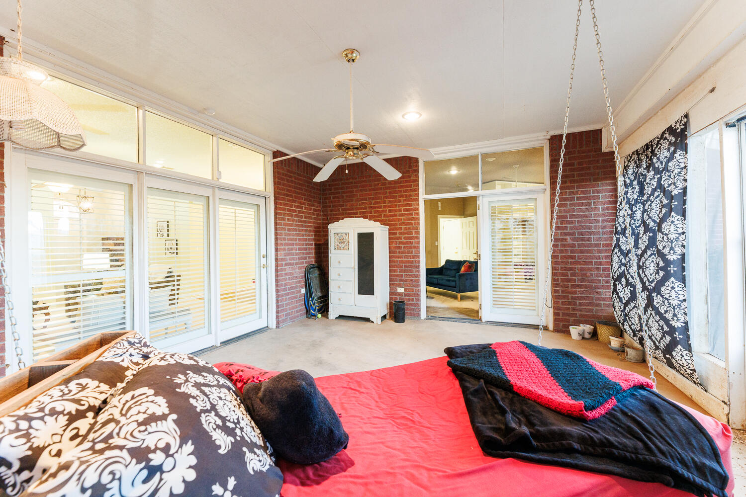 206 Collins Avenue Sundown, TX 79372 - Photo 55 of 82 a bedroom with a large bed and a large window