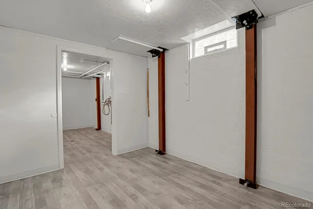 a view of hallway with wooden floor