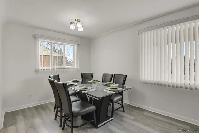a view of a dining room with furniture and window