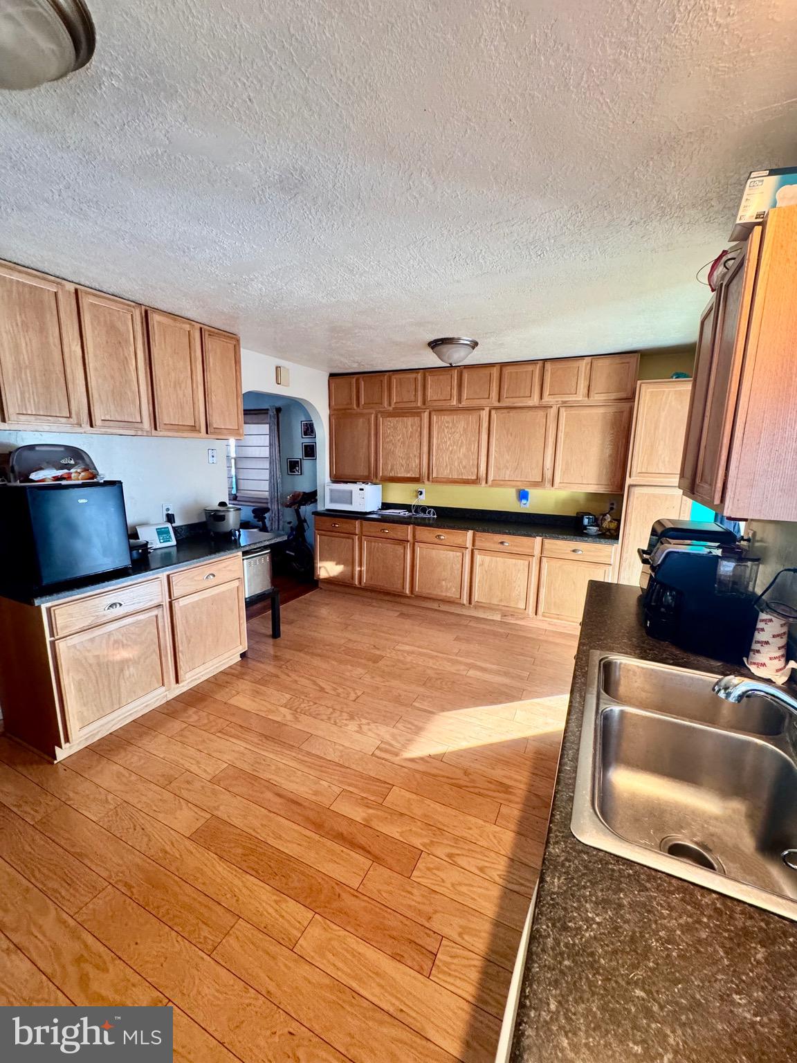 1286 Harding Road Vineland, NJ 08361 - Photo 5 of 40 a kitchen with stainless steel appliances granite countertop a sink and a stove top oven