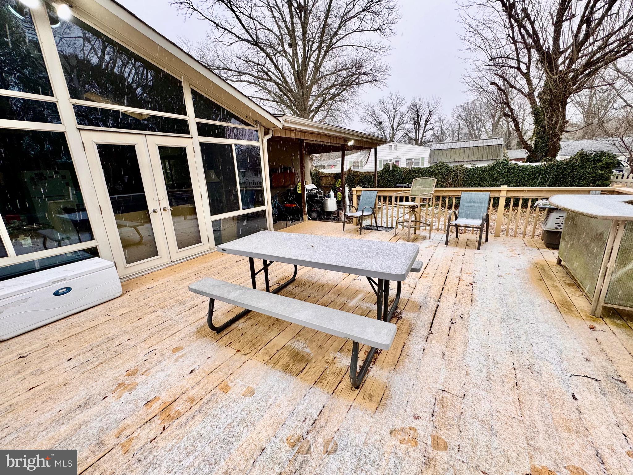 1286 Harding Road Vineland, NJ 08361 - Photo 10 of 40 a view of a patio with a dining table and chairs with wooden floor and fence
