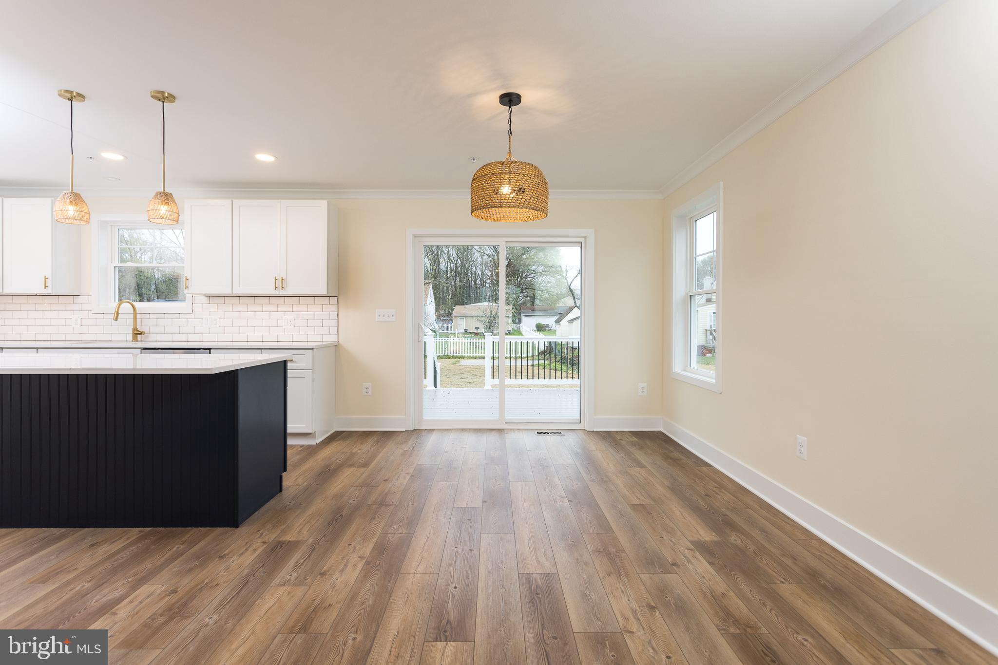 2905 Sparrows Point Road Sparrows Point, MD 21219 - Photo 13 of 32 a kitchen with a sink wooden floor and window