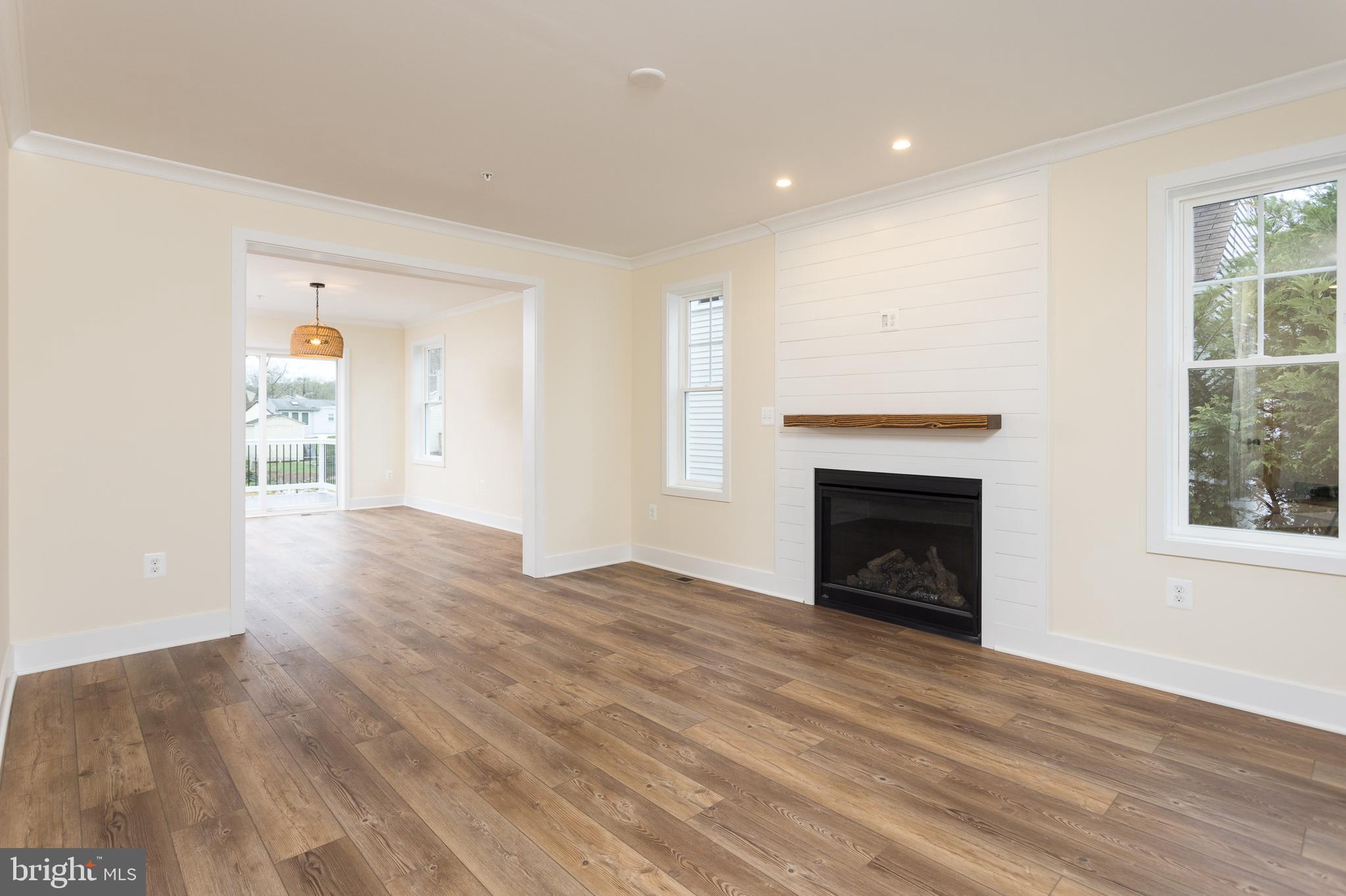 2905 Sparrows Point Road Sparrows Point, MD 21219 - Photo 15 of 32 a view of a livingroom with wooden floor and a fireplace