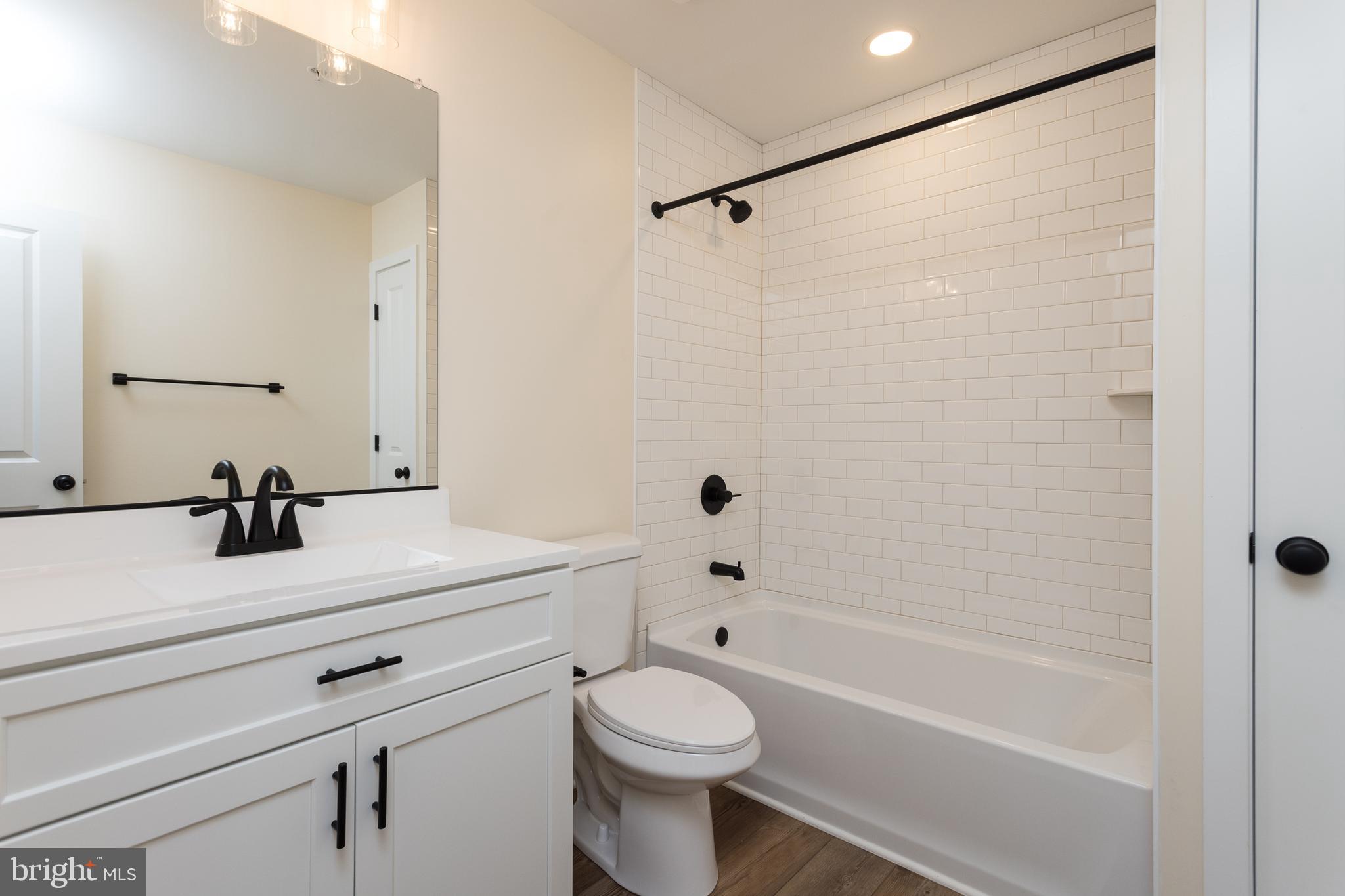 2905 Sparrows Point Road Sparrows Point, MD 21219 - Photo 21 of 32 a bathroom with a sink a toilet and shower