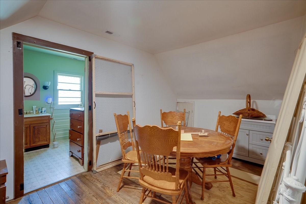7480 Beech Hill Road Pulaski, TN 38478 - Photo 23 of 54 a view of a dining room with furniture and wooden floor