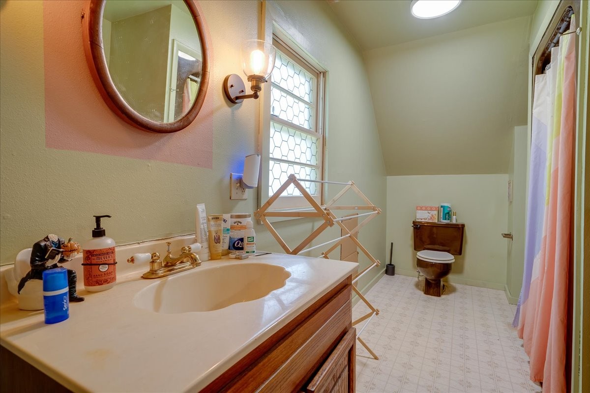 7480 Beech Hill Road Pulaski, TN 38478 - Photo 25 of 54 a bathroom with a sink a mirror and a window