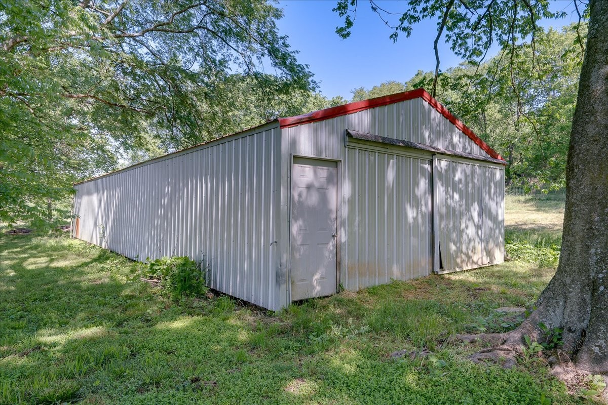 7480 Beech Hill Road Pulaski, TN 38478 - Photo 27 of 54 a backyard of a house with lots of green space