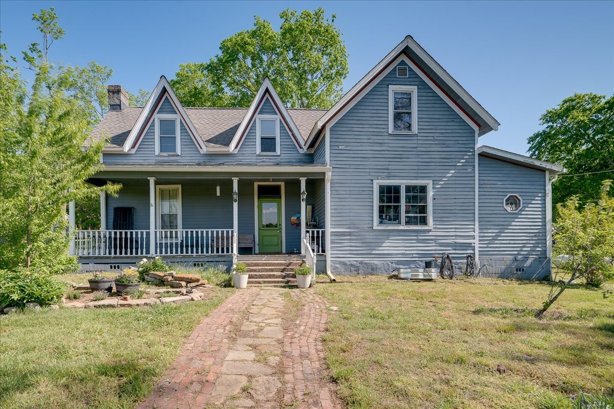 7480 Beech Hill Road Pulaski, TN 38478 - Photo 31 of 54 a front view of a house with garden