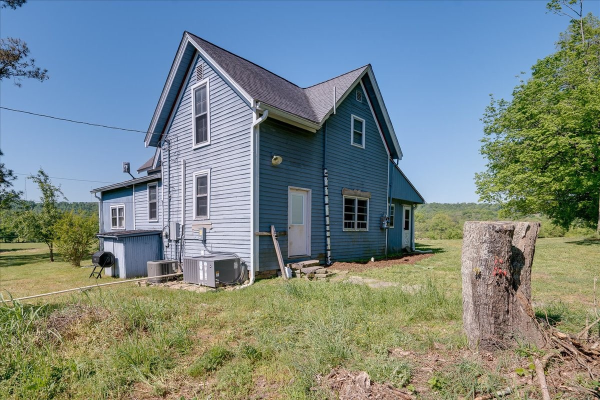 7480 Beech Hill Road Pulaski, TN 38478 - Photo 33 of 54 a view of a house with a yard and garage