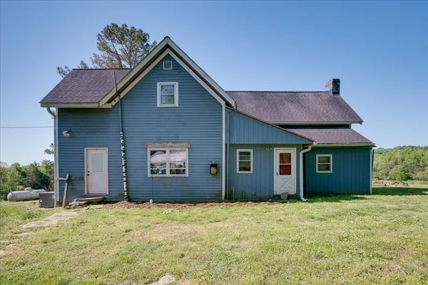a aerial view of a house with a yard