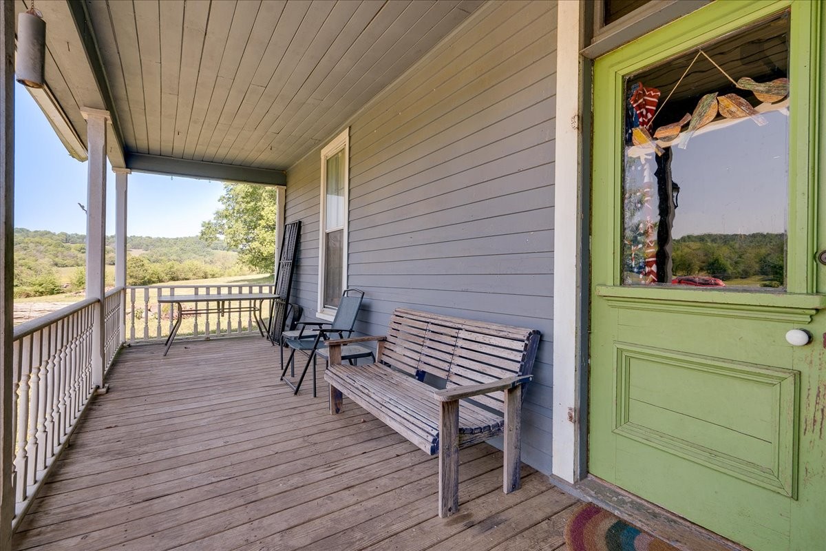 7480 Beech Hill Road Pulaski, TN 38478 - Photo 5 of 54 a view of a balcony with chairs and wooden floor