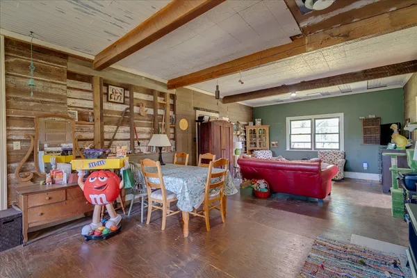 a living room filled with furniture and a window