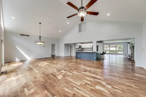 a kitchen with stainless steel appliances granite countertop a stove and a sink