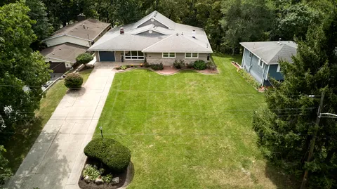 a aerial view of a house with swimming pool and patio