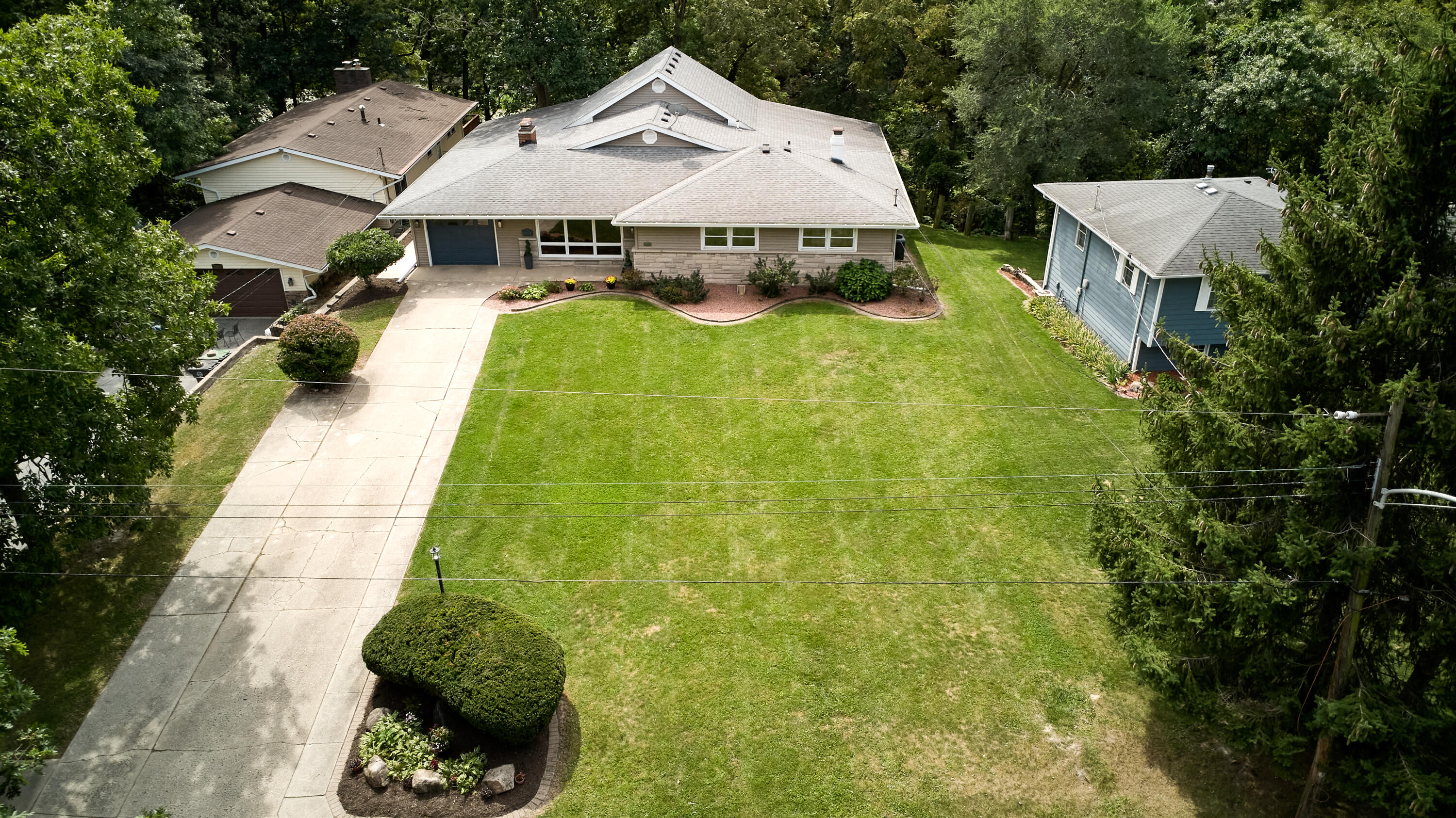 1009 Lake George Drive Hobart, IN 46342 - Photo 2 of 73 a aerial view of a house with swimming pool and patio