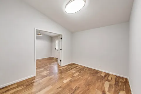 a bathroom with a toilet a sink a shower and mirror