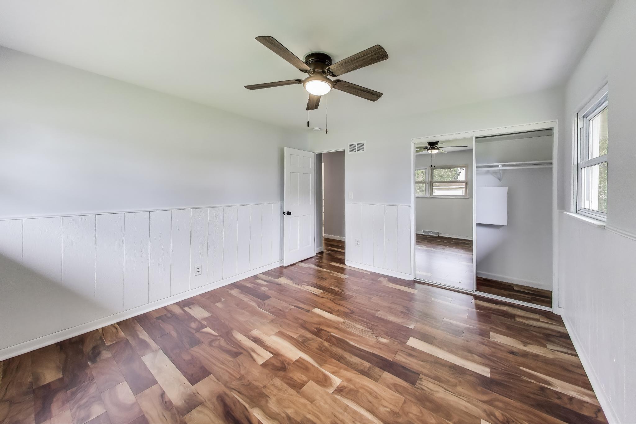 1009 Lake George Drive Hobart, IN 46342 - Photo 33 of 73 a view of empty room with wooden floor and ceiling fan