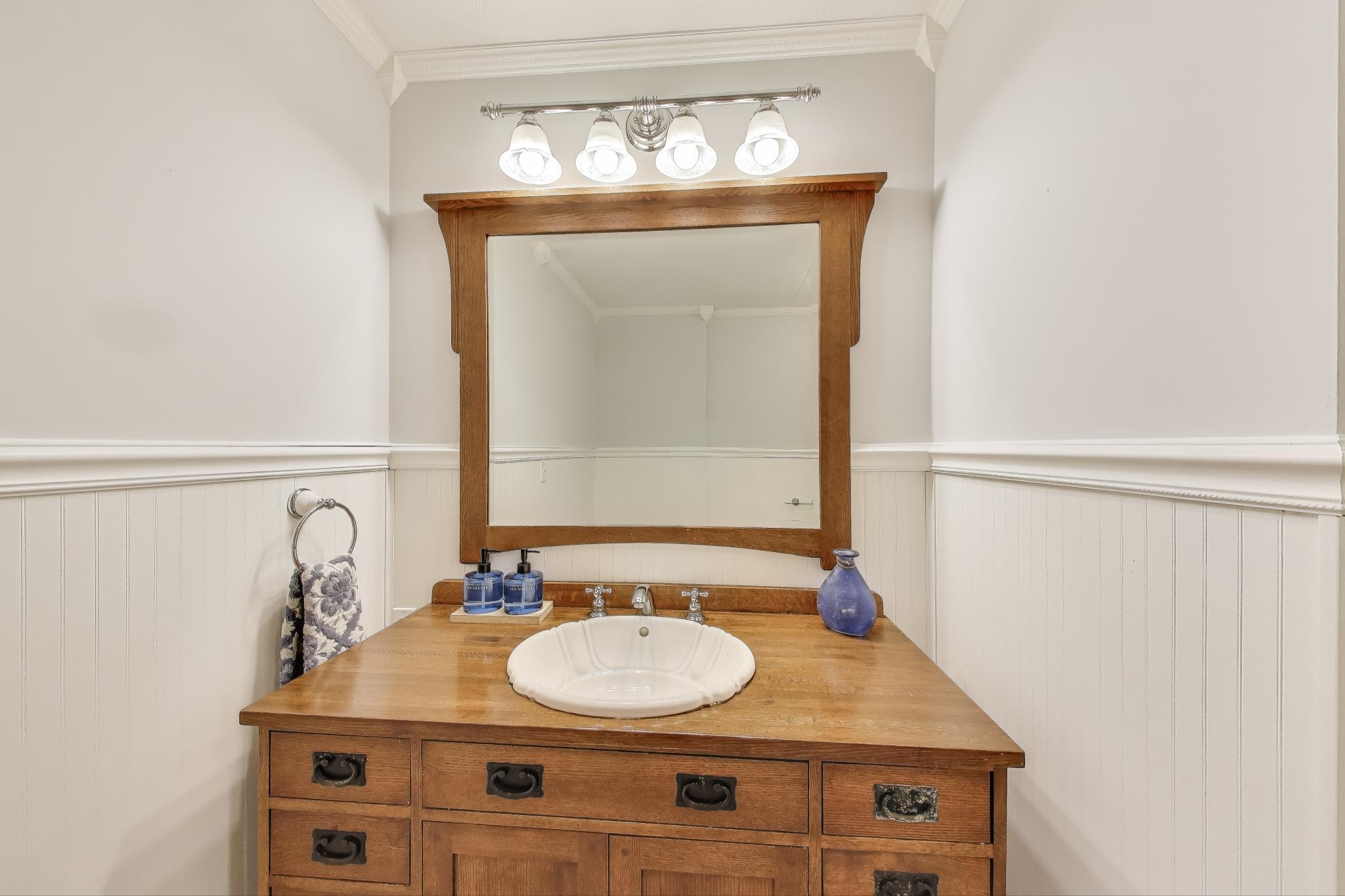 1009 Lake George Drive Hobart, IN 46342 - Photo 35 of 73 a bathroom with a sink and a mirror