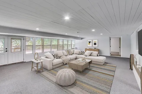 an empty room with a empty space and windows