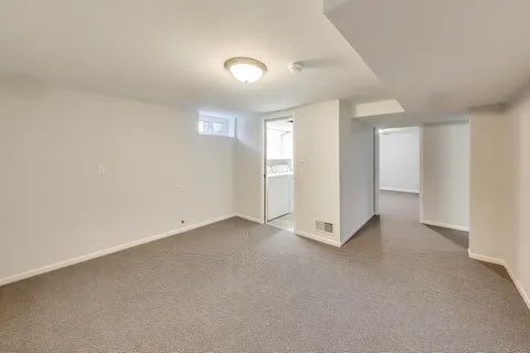 an aerial view of a house with a lake view
