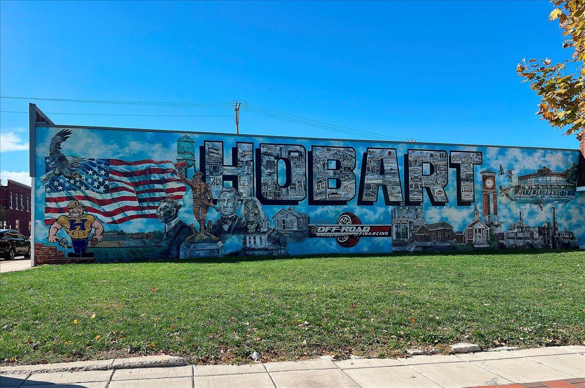 1009 Lake George Drive Hobart, IN 46342 - Photo 70 of 73 a view of a house with a yard and potted plants