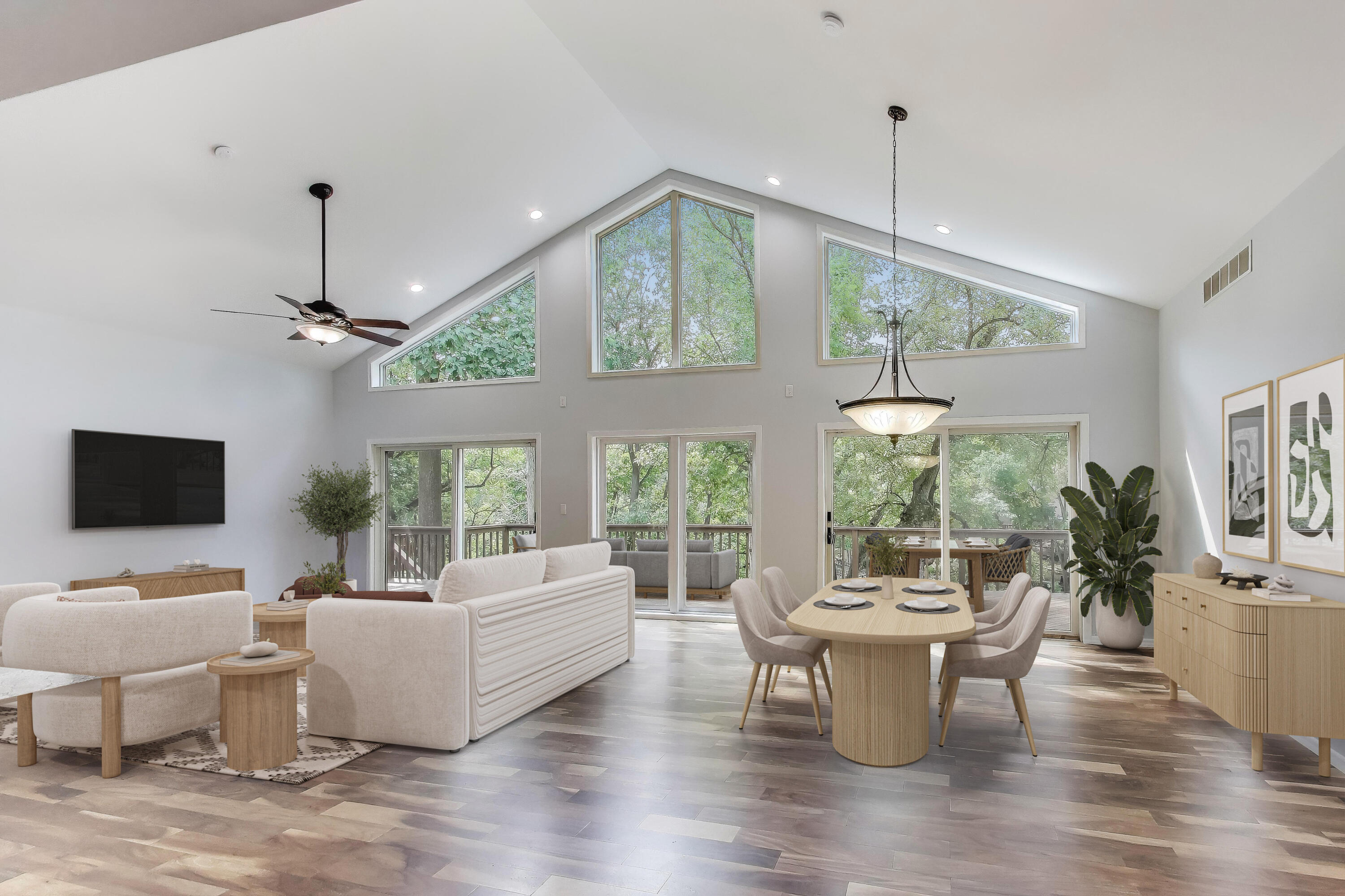 1009 Lake George Drive Hobart, IN 46342 - Photo 10 of 73 a living room with furniture a chandelier and a flat screen tv