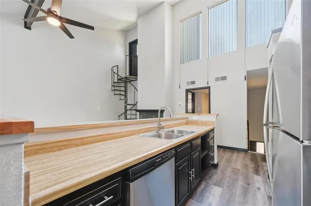 a kitchen with a sink and a refrigerator