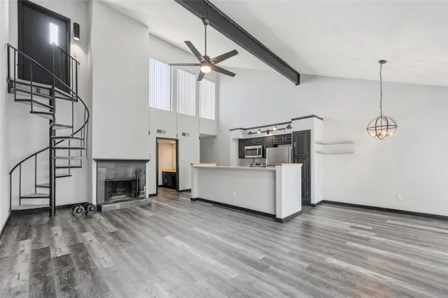 a view of a kitchen with furniture and a fireplace