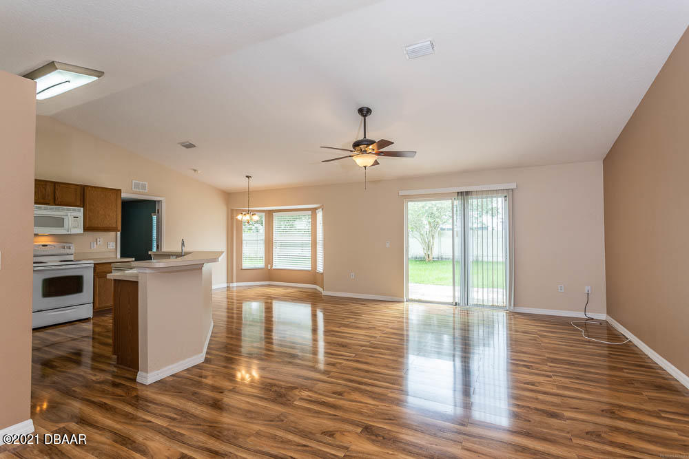 52 Underwick Path Palm Coast, FL 32164 - Photo 3 of 21 a view of a kitchen with microwave and stove