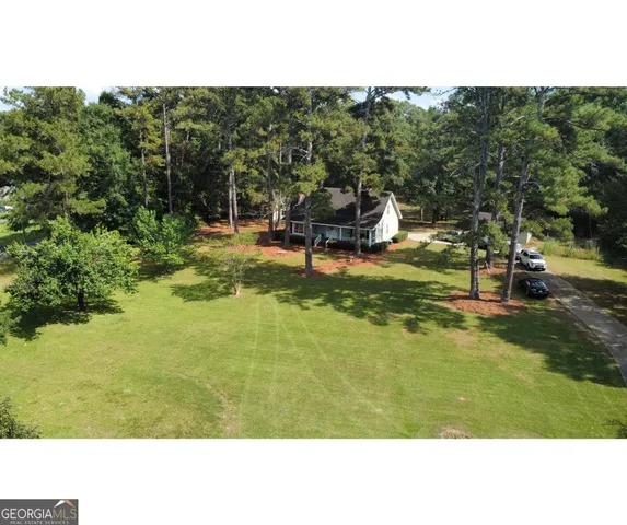 a kitchen with a sink a stove and cabinets