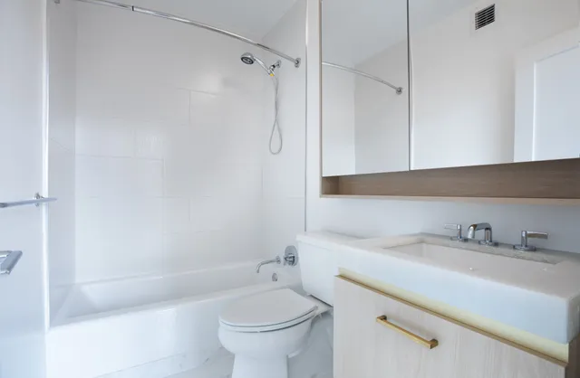 a bathroom with a sink and a bathtub