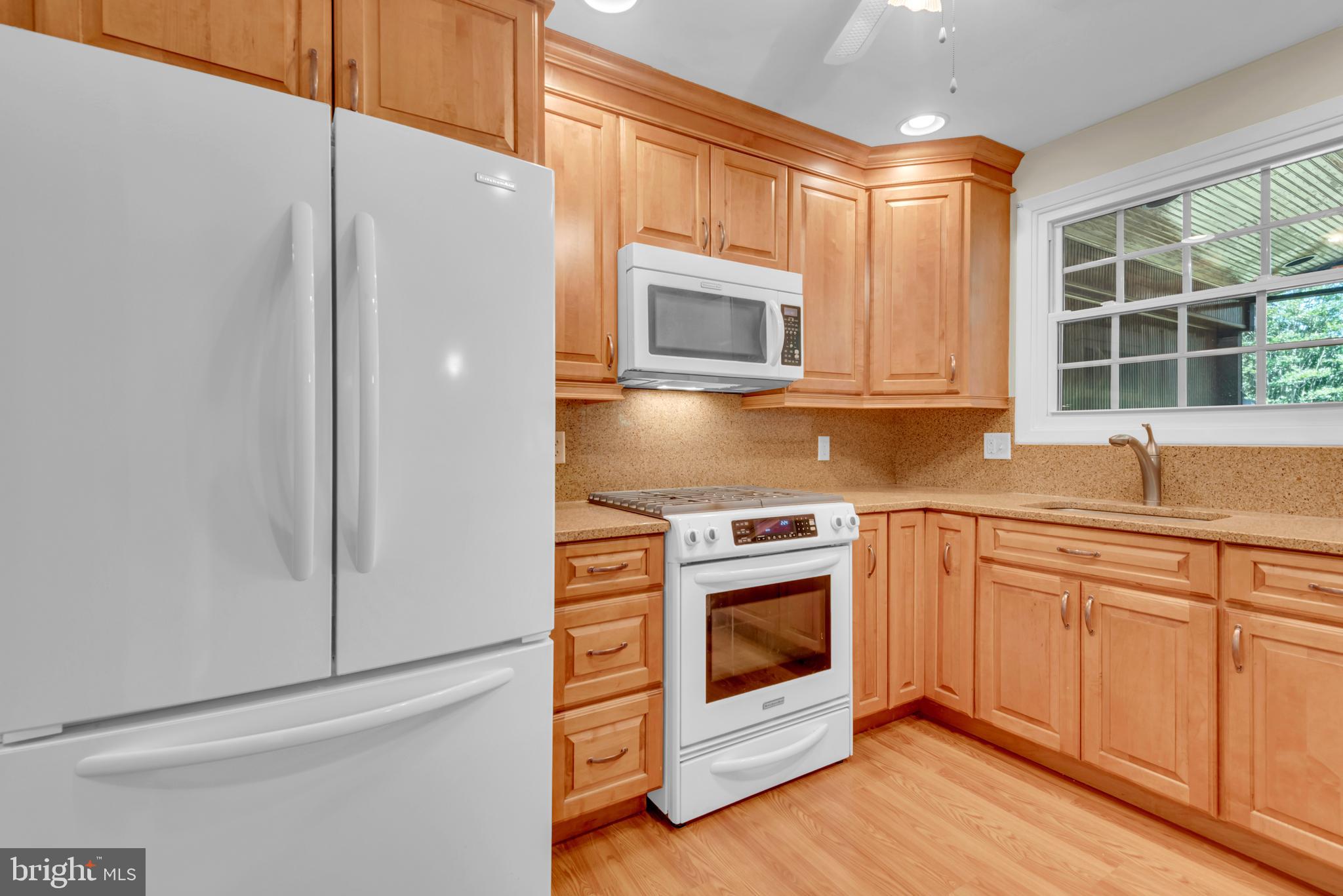 1702 Pot Spring Road Lutherville-Timonium, MD 21093 - Photo 17 of 39 Gas cooking and granite countertops in kitchen