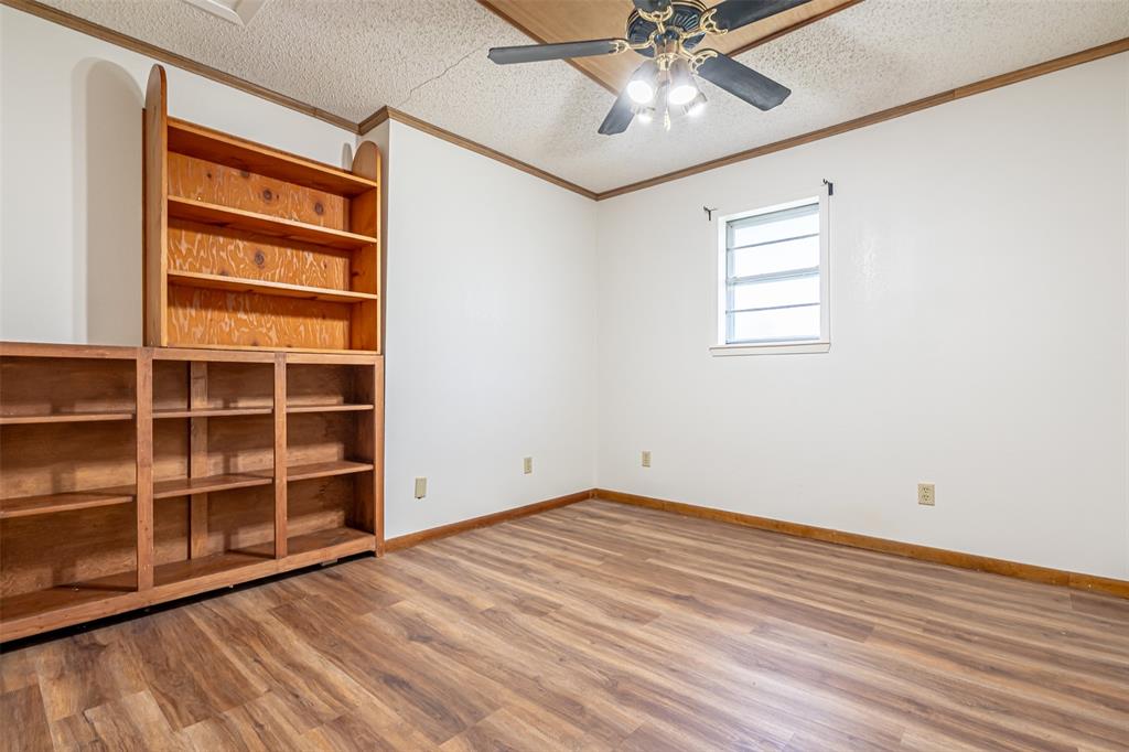 501 Endora Dublin, TX 76446 - Photo 26 of 39 wooden floor in an empty room with a window
