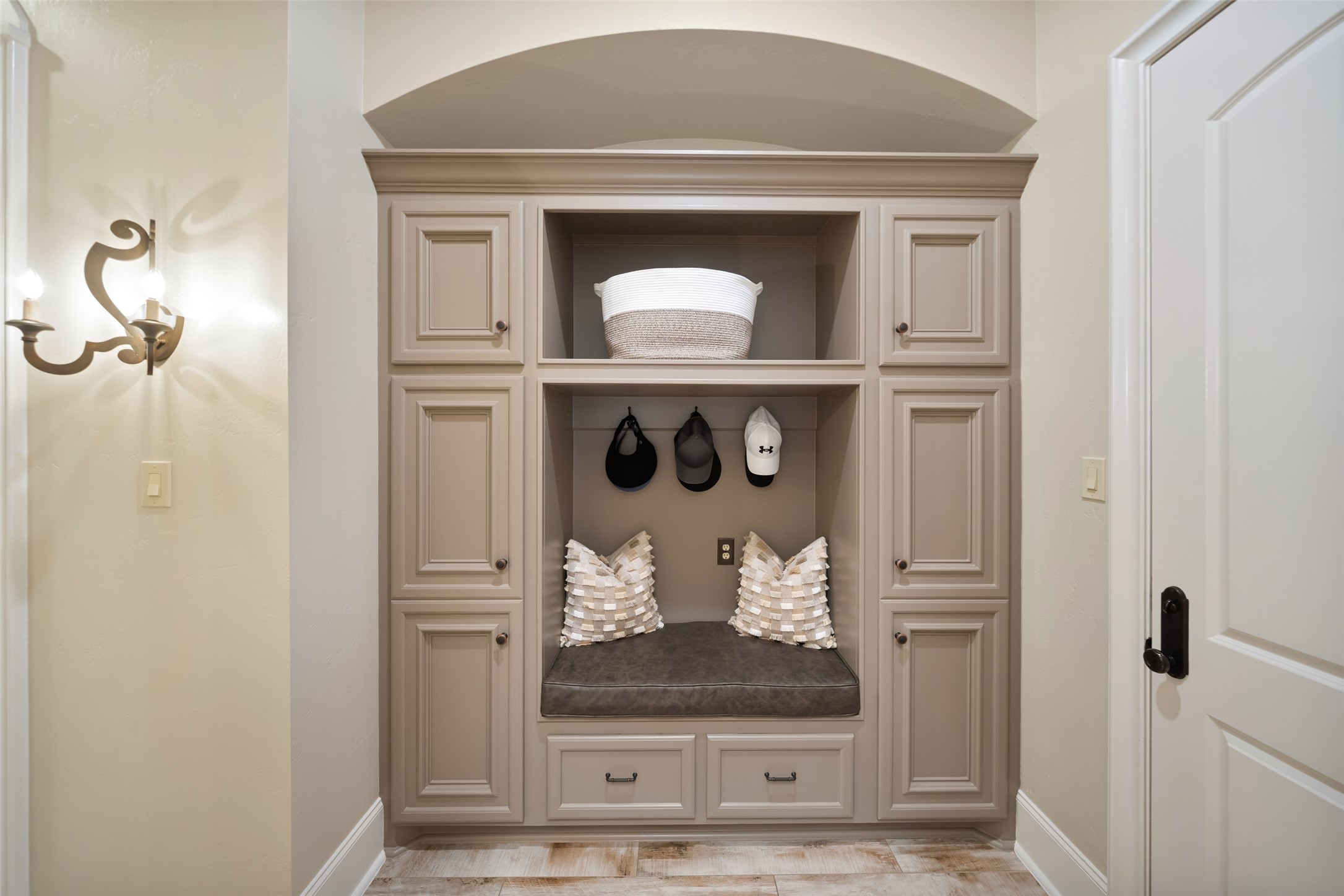 59 East Ambassador Bend Spring, TX 77382 - Photo 13 of 48 Conveniently located off the two-car garage, the mudroom features built-in cabinetry and hanging space, offering excellent storage and organization.