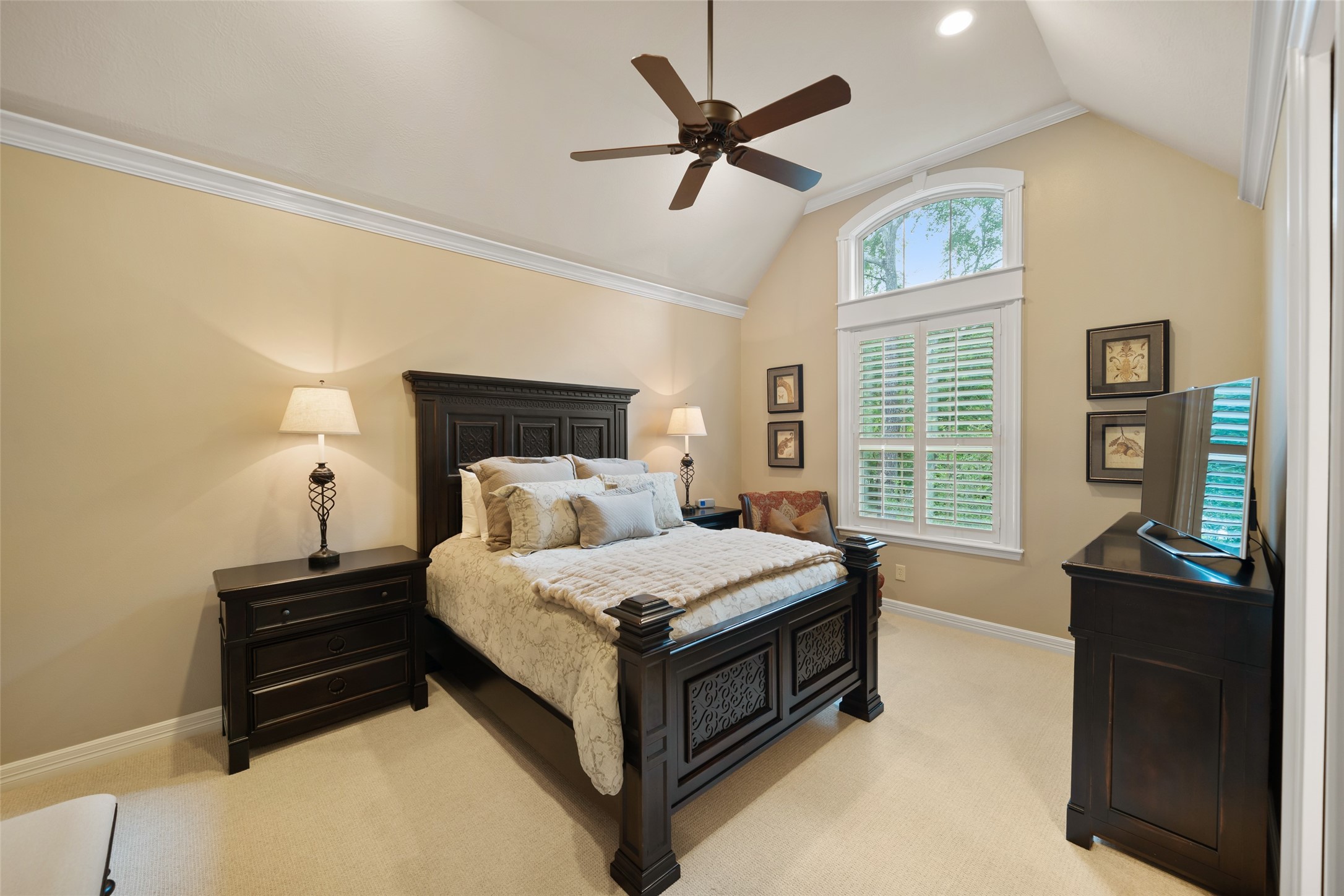 59 East Ambassador Bend Spring, TX 77382 - Photo 30 of 48 This secondary bedroom suite features cove ceilings and a statement window offering peaceful views of the lovely outdoors and beyond, creating a serene retreat for guests or family. All doors in the home are solid-core doors.
